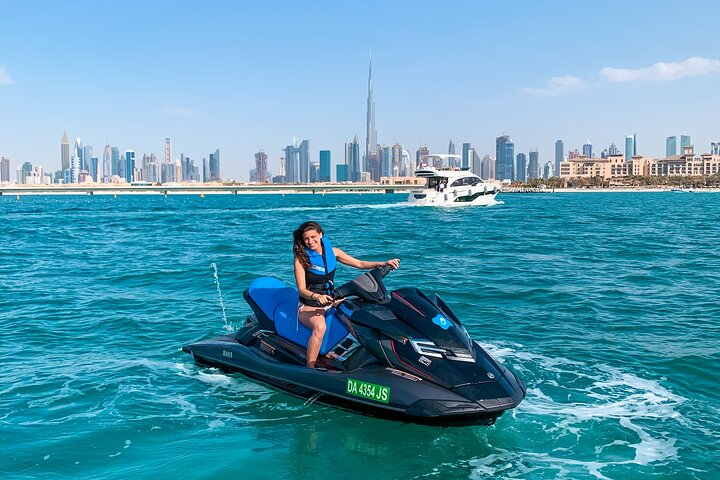 Feel the rush of gliding across azure waters while surrounded by Dubai's stunning skyline featuring iconic landmarks like Burj Al Arab and Burj Khalifa—an unforgettable aquatic adventure awaits.